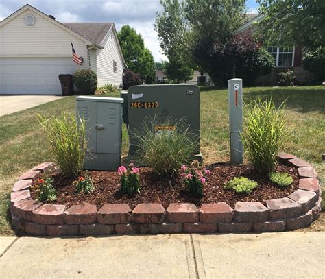 how to hide electrical boxes in front yard|underground utility boxes.